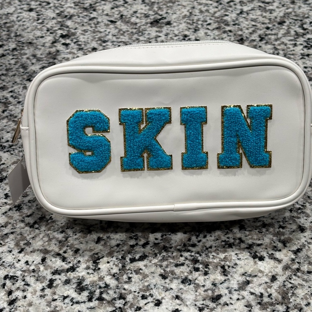 White Pouch with Blue and Gold 'SKIN' Design - Picture 6 of 9